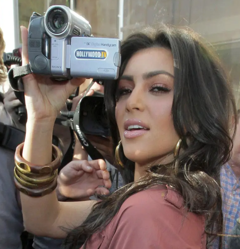 Kim Kardashian holding a Hollywood.TV camera